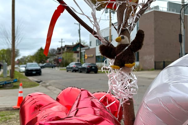 Items are placed as a memorial at the site of a late Tuesday fatal shooting, on Friday, May 2, 2025 in Minneapolis. (AP Photo/Mark Vancleave)