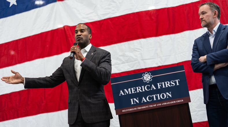 U.S. Trade Representative Jamieson Greer, right, listens to Rep. John James, R-Mich., left, speak during a tour of Atomic Industries' manufacturing facility, Thursday, April 9, 2026, in Warren, Mich. (AP Photo/Julia Demaree Nikhinson)