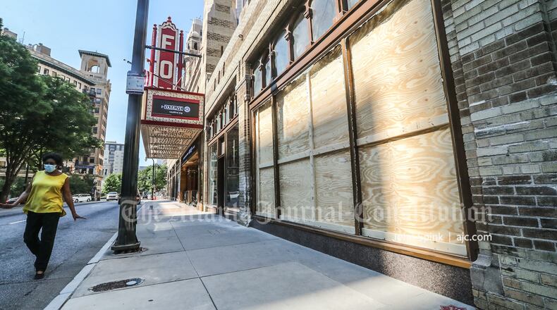 The front windows of the iconic Fox Theatre along Peachtree Street were boarded up Monday after a weekend crash.