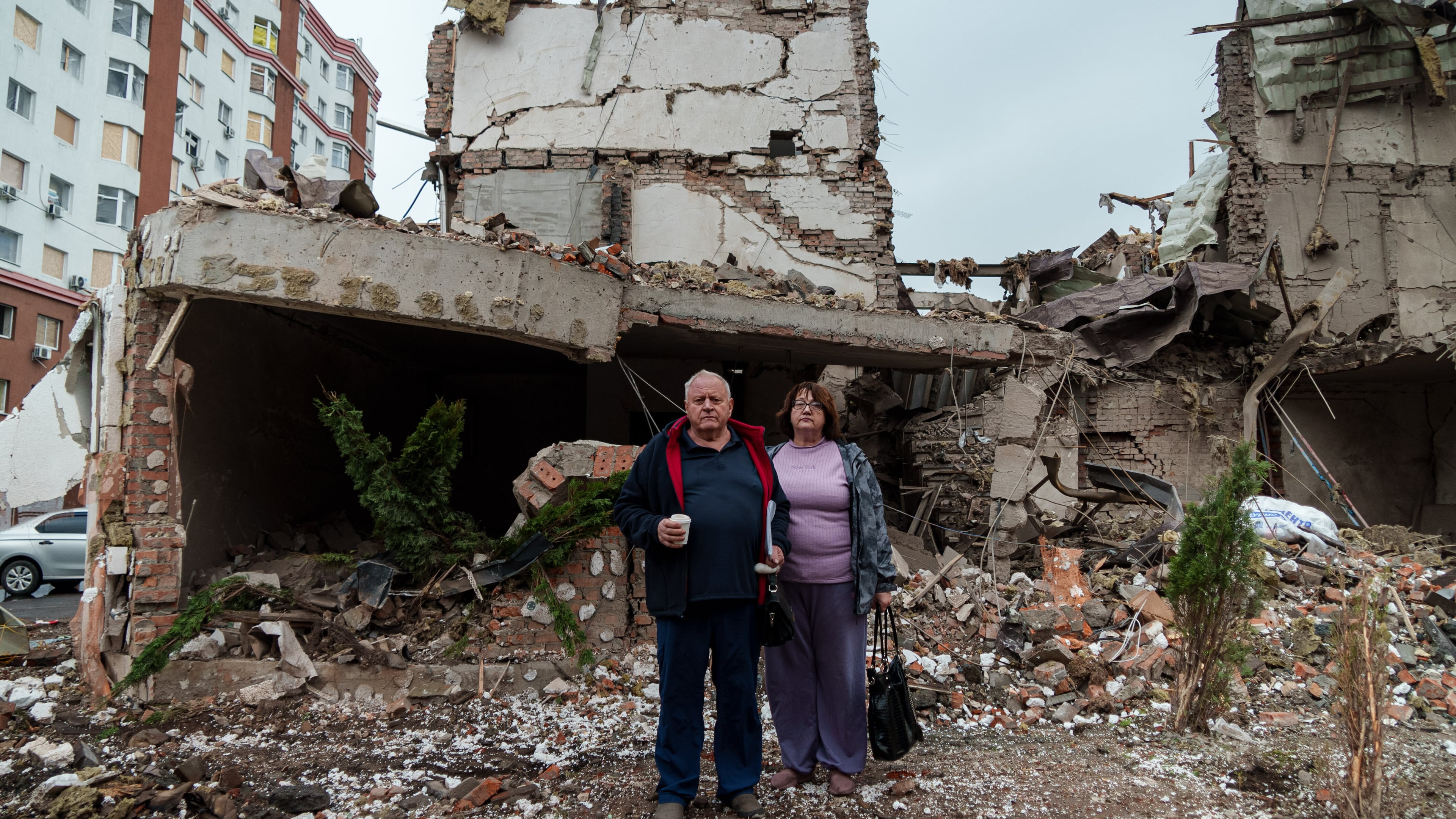 Mykola Pastukh, 67, with his wife Oksana Pastukh, 58, stand next to their house destroyed in a Russian attack in Kyiv, Ukraine, on Monday, Sept. 29, 2025. (AP Photo/Vasilisa Stepanenko)