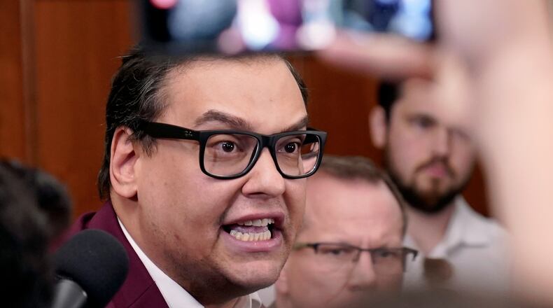 FILE - Rep. George Santos, R-N.Y., talks to reporters as House Republicans hold a caucus meeting at the Capitol in Washington, Oct. 13, 2023. (AP Photo/Mariam Zuhaib, File)