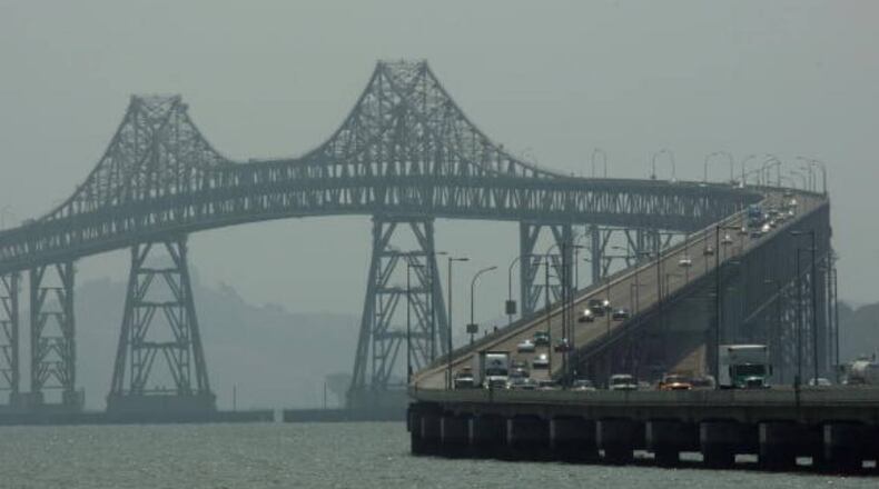 Two baseball-sized chunks of concrete fell from the San Rafael-Richmond Bridge onto a car Friday night.