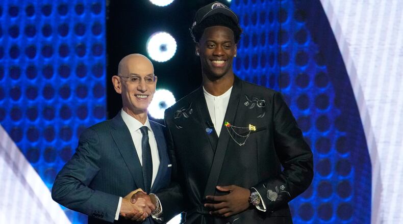 AJ Dybantsa, right, poses for a photo with NBA commissioner Adam Silver, left, after being selected by the Washington Wizards as the first pick in the first round of the NBA basketball draft, Tuesday, June 23, 2026, in New York. (AP Photo/Yuki Iwamura)