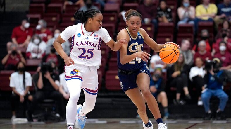Georgia Tech guard Eylia Love (24) brings the ball up as Kansas guard Chandler Prater (25) defends during the first half of a first-round game in the NCAA women's college basketball tournament Friday, March 18, 2022, in Stanford, Calif. (AP Photo/Tony Avelar)