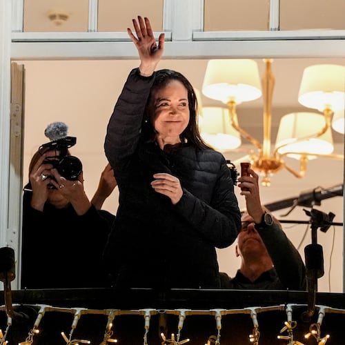 Nobel Peace Prize laureate Maria Corina Machado waves at the Grand Hotel in Oslo, Norway, early Thursday, Dec. 11, 2025. (Lise Åserud/NTB Scanpix via AP)