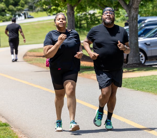 Christopher and Nicole Russell yearn to lace up and join 60,000 fellow runners for Atlanta's most iconic race. (Phil Skinner for The Atlanta Journal-Constitution)
