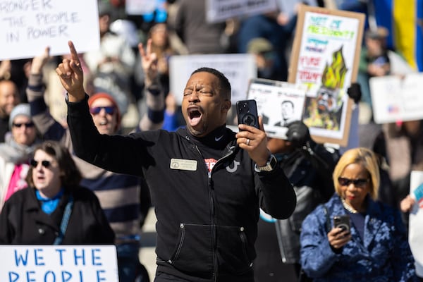 State Rep. Derrick Jackson, D-Tyrone, spoke at a rally in Atlanta protesting President Donald Trump's policies in February.