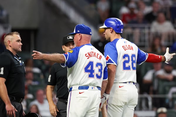 Braves manager Brian Snitker (left) and first baseman Matt Olson both got tossed from Saturday's game. 