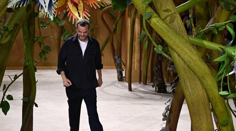 Designer Matthieu Blazy accepts applause after the Chanel Haute Couture Fall/Winter 2026-2027 Women's collection presented in Paris, Tuesday, July 7, 2026. (AP Photo/Emma Da Silva)