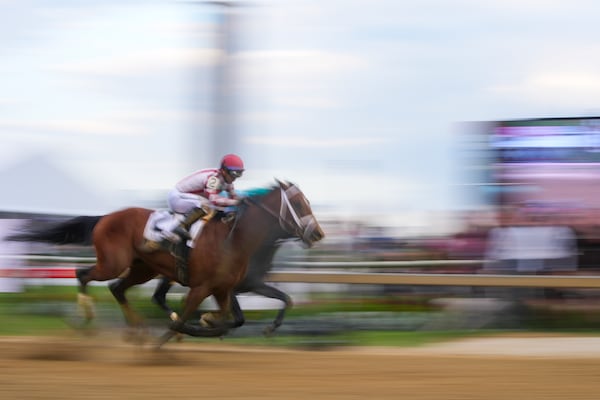 Umberto Rispoli, front atop Journalism, edges out Luis Saez, atop Gosger, to win during the 150th running of the Preakness Stakes horse race Saturday, May 17, 2025, at Pimlico Race Course in Baltimore. (AP Photo/Julio Cortez)