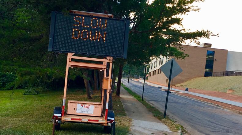 Decatur’s new Talley Street Upper Elementary is on the right. Cars can enter campus only by heading up hill on Talley and turning right into the school. Cars will exit by turning right out of the campus. No car will be allowed to turn left into the school or left out of the school onto Talley Street. Bill Banks for the AJC
