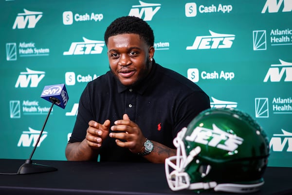Offensive tackle Armand Membou, the New York Jets first round draft pick, seventh overall, speaks during an NFL football press conference at team's training facility Friday, April 25, 2025, in Florham Park, N.J. (AP Photo/Kena Betancur)