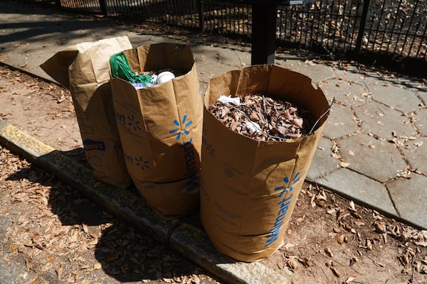 Bags of dead leaves line the curb in Inman Park in Atlanta on Tuesday, Sept. 16, 2025. (Abbey Cutrer/AJC)
