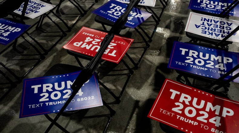 FILE — Campaign signs for former president Donald Trump cover chairs before a campaign event in Waterford, Mich., Feb. 17, 2024. Trump won commanding victories over Nikki Haley on Super Tuesday that pushed her from the race, but he does not appear to have broadened his support beyond the Republican base. (Emily Elconin/The New York Times)