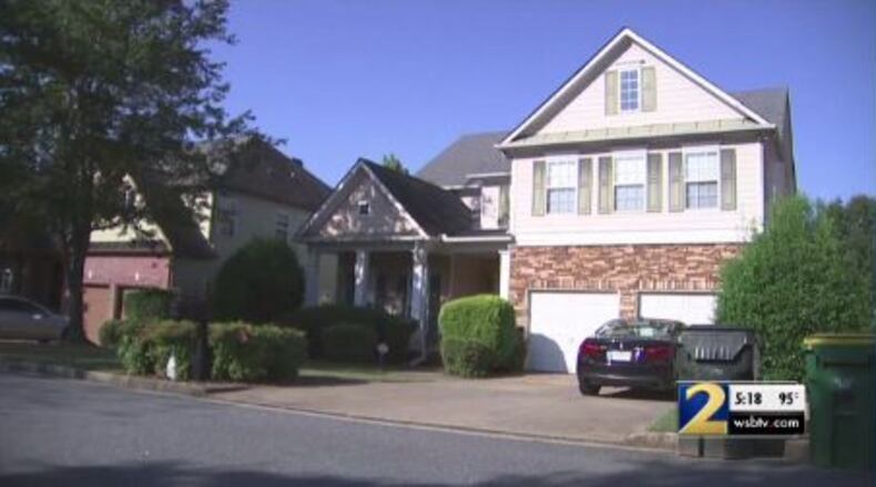 A Milton father was charged after accidentally shooting his daughter in the head while showing off his gun to a friend, police said.