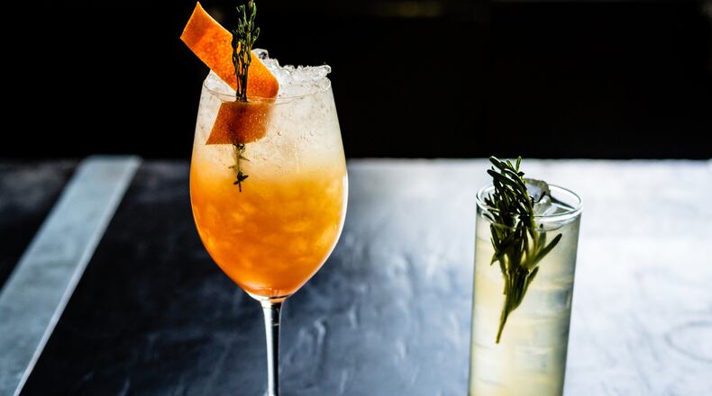 Two cocktails from Restaurant Eugene: A Spritz in Thyme (left) and Dreams of Oporto (right). CONTRIBUTED BY HENRI HOLLIS