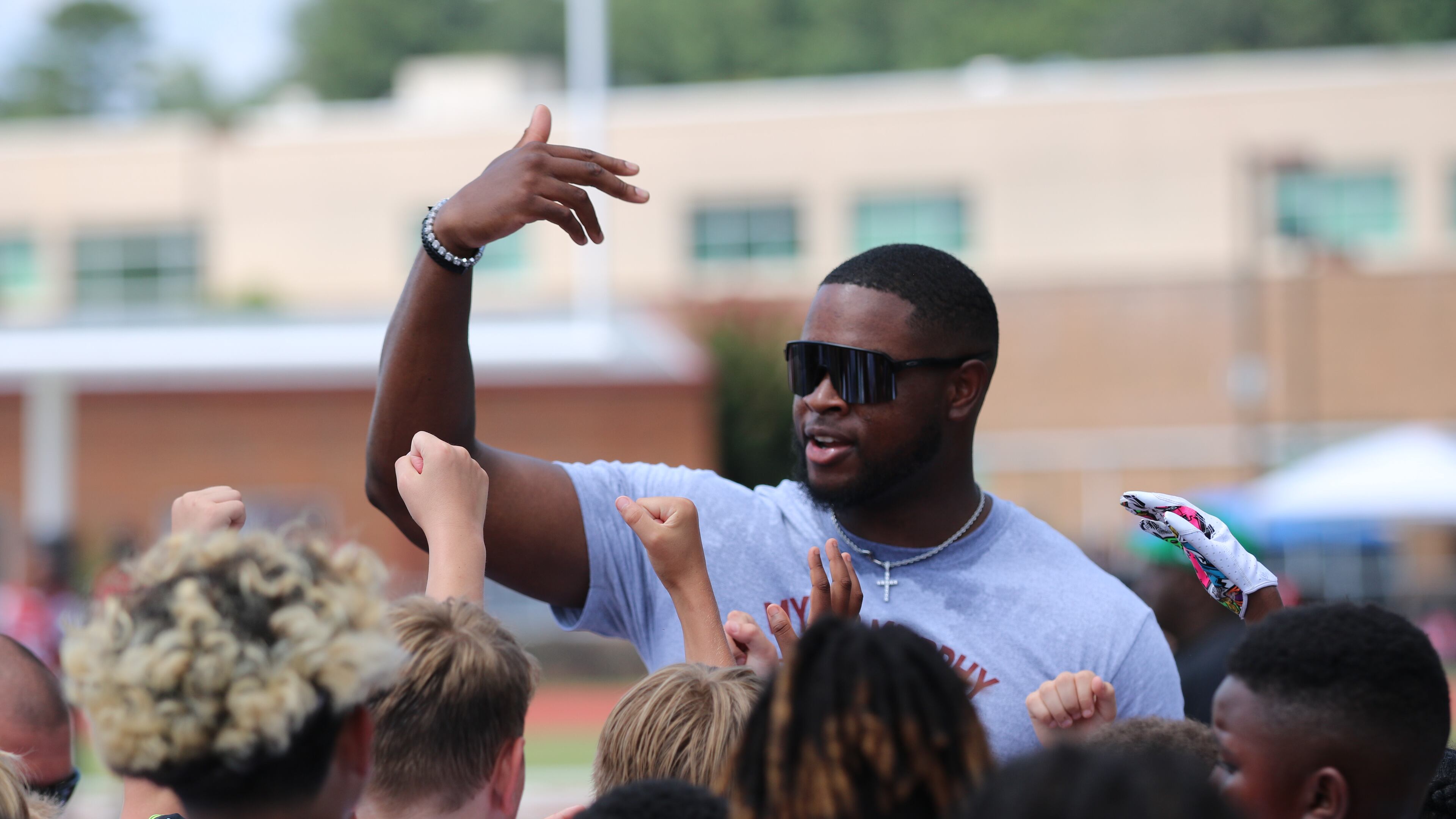 Cincinnati Bengals defensive lineman Myles Murphy instructs young football players at the Myles Murphy Foundation Football Youth Skills Camp at Hillgrove High, Murphy's alma mater. Murphy was among five current NFL players from Hillgrove who worked at the camp. (Warren J. Buchanan Sr./Hillgrove)