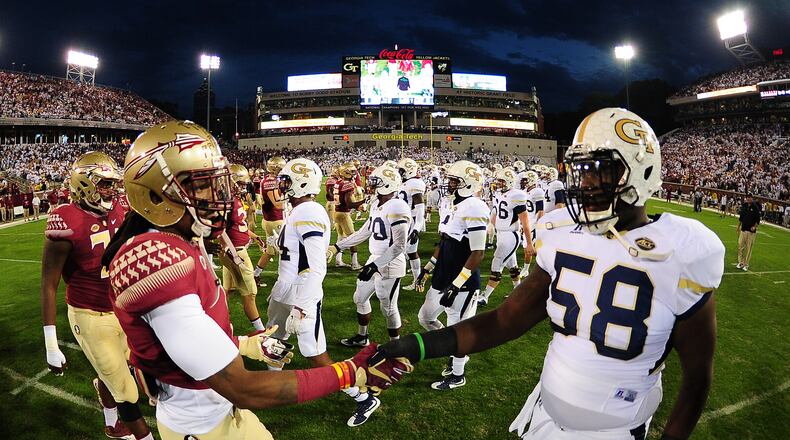 ATLANTA, GA - OCTOBER 24: Ermon Lane #1 of the Florida State Seminoles greets Freddie Burden #58 of the Georgia Tech Yellow Jackets at midfield before the game in an ACC sportsmanship initiative at Bobby Dodd Stadium on October 24, 2015 in Atlanta, Georgia. Photo by Scott Cunningham/Getty Images)