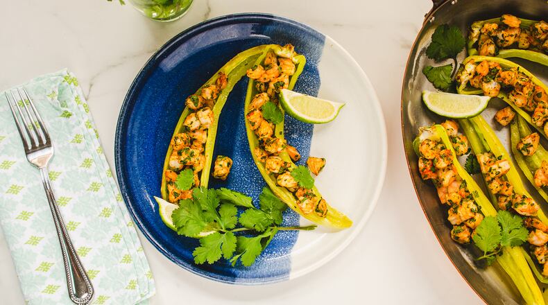 Tender shrimp flavored with herbs and spices are stuffed into peppers for a simple meal with subtle heat and big flavor.
(Virginia Willis for The Atlanta Journal-Constitution)