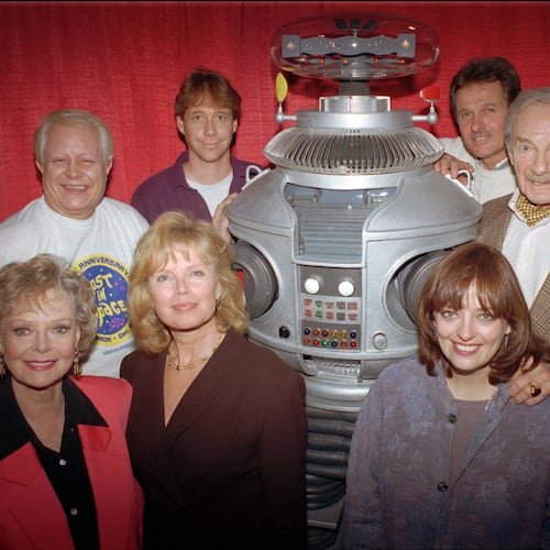 FILE - In this file photo showing the crew from the original cast of the television series "Lost in Space" from left in the back row are: Bob May, Bill Mumy, Mark Goddard, Jonathan Harris; in the front row from left: June Lockhart, Marta Kristen, Angela Cartwright in Boston on Dec. 2, 1995. (AP Photo/Steven Senne, File)