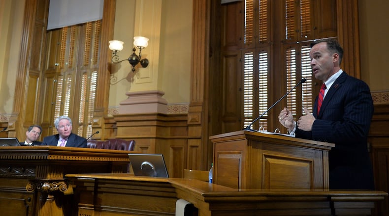 Members of the State Election Board listen as investigator Chris Harvey (right) gives an update into the New Georgia Project voter registration drive. during their meeting at the Capitol, Tuesday, October 7, 2014. KENT D. JOHNSON/KDJOHNSON@AJC.COM