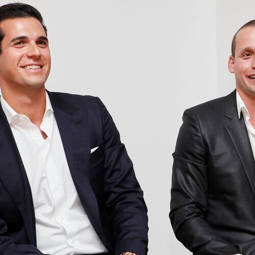 FILE - Oren and Tal Alexander speak at a panel at the Rockstars of Real Estate Event, Sept. 3, 2013 in New York. (Photo by Amy Sussman/Invision for DETAILS Magazine/AP Images, File)