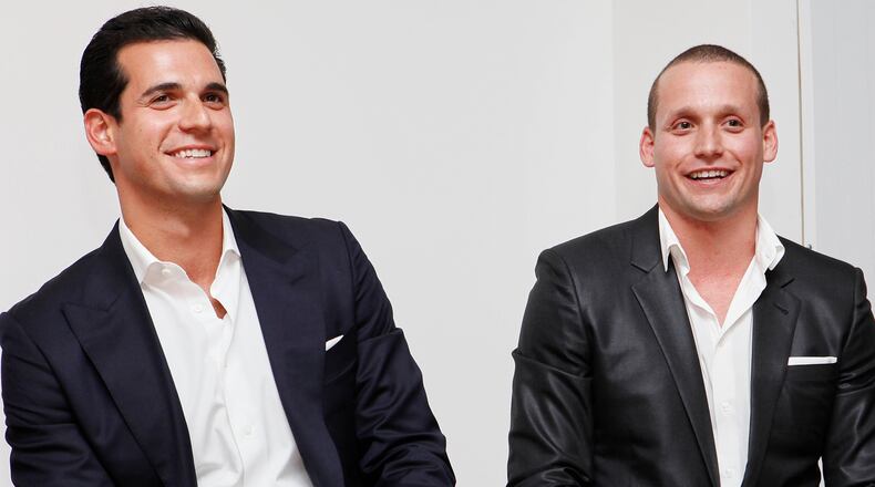 FILE - Oren and Tal Alexander speak at a panel at the Rockstars of Real Estate Event, Sept. 3, 2013 in New York. (Photo by Amy Sussman/Invision for DETAILS Magazine/AP Images, File)