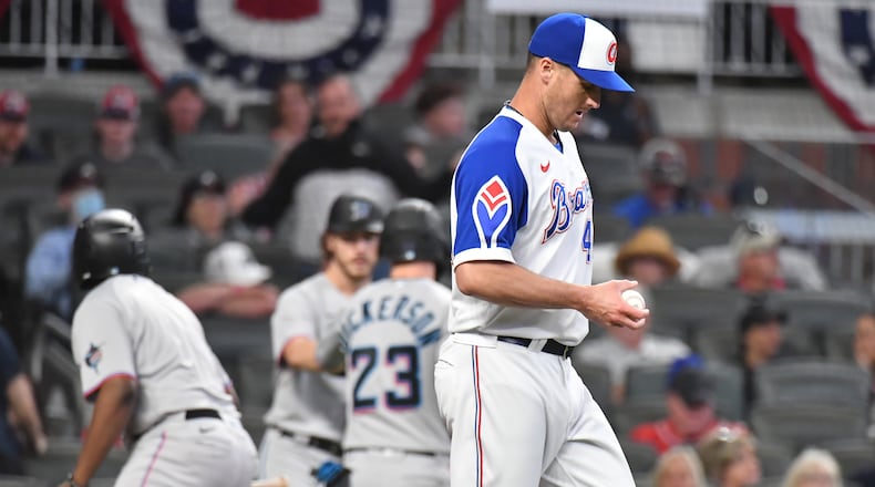 Braves relief pitcher Nate Jones (49) reacts after allowing a two-run double in the 8th inning against the Miami Marlins Monday, April 12, 2021, at Truist Park in Atlanta. The Marlins won 5-3 in extra innings. (Hyosub Shin / Hyosub.Shin@ajc.com)