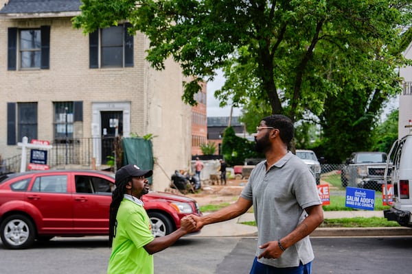 Former District of Columbia Councilman Trayon White talks to a voter outside Union Temple Baptist Church during the Ward 8 special election, Tuesday, July 15, 2025, in Washington. (AP Photo/Julia Demaree Nikhinson)