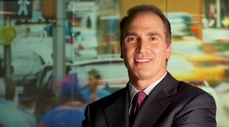 NCR's top executive, Bill Nuti, works out of New York but says the company is committed to Atlanta and its plan for a new headquarters in Midtown.