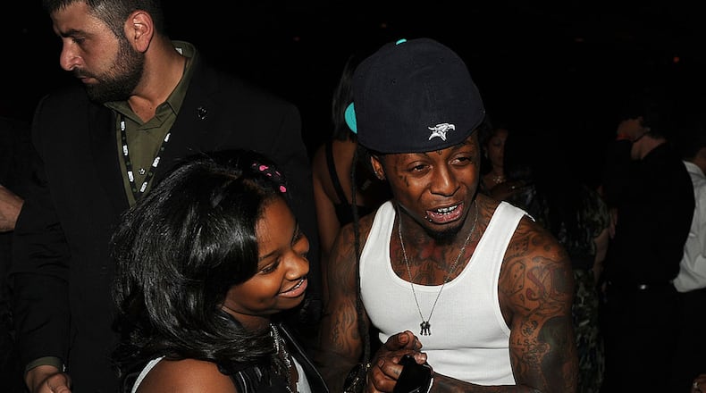 LOS ANGELES, CA - JUNE 26: Reginae Carter (L) and rapper Lil Wayne in the audience during the BET Awards '11 held at the Shrine Auditorium on June 26, 2011 in Los Angeles, California. (Photo by Kevin Winter/Getty Images)
