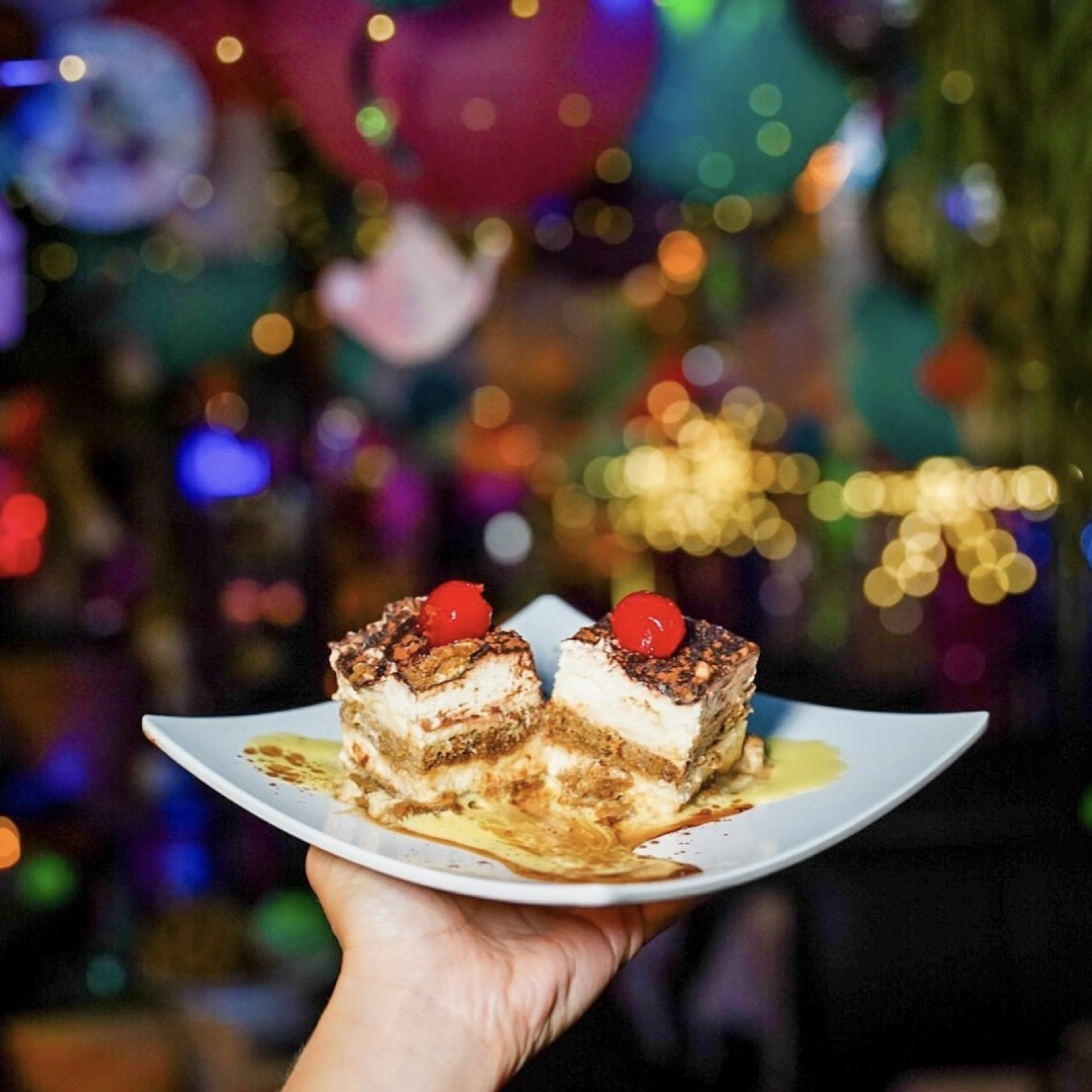 The famously over-the-top holiday decorations at Amore e Amore serve as a backdrop for a dessert plate. (Credit: Sam Nadolski Milero, courtesy of Amore e Amore)