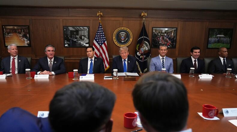 President Donald Trump, seated center, joined by Energy Secretary Chris Wright, from left, Interior Secretary Doug Burgum, Secretary of State Marco Rubio, Defense Secretary Pete Hegseth, acting Labor Secretary Keith Sonderling, and Housing and Urban Development Secretary Scott Turner, attends a cabinet meeting, Friday, July 31, 2026, at Camp David, the presidential retreat, near Thurmont, Md., Friday, July 31, 2026. (AP Photo/Jacquelyn Martin)