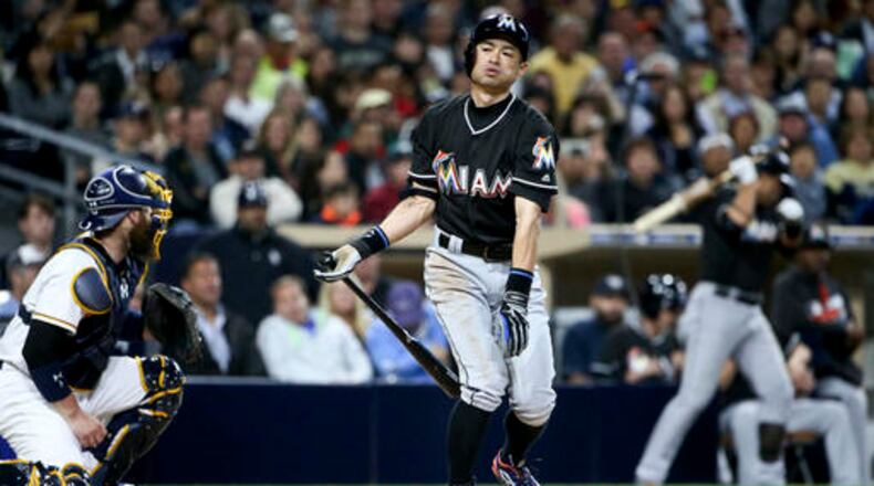 Miami Marlins' Ichiro Suzuki fouls off a pitch toward teammate Martin Prado in the on-deck circle while batting for a second time in the third inning against the San Diego Padres in a baseball game Monday, June 13, 2016, in San Diego. (AP Photo/Lenny Ignelzi)