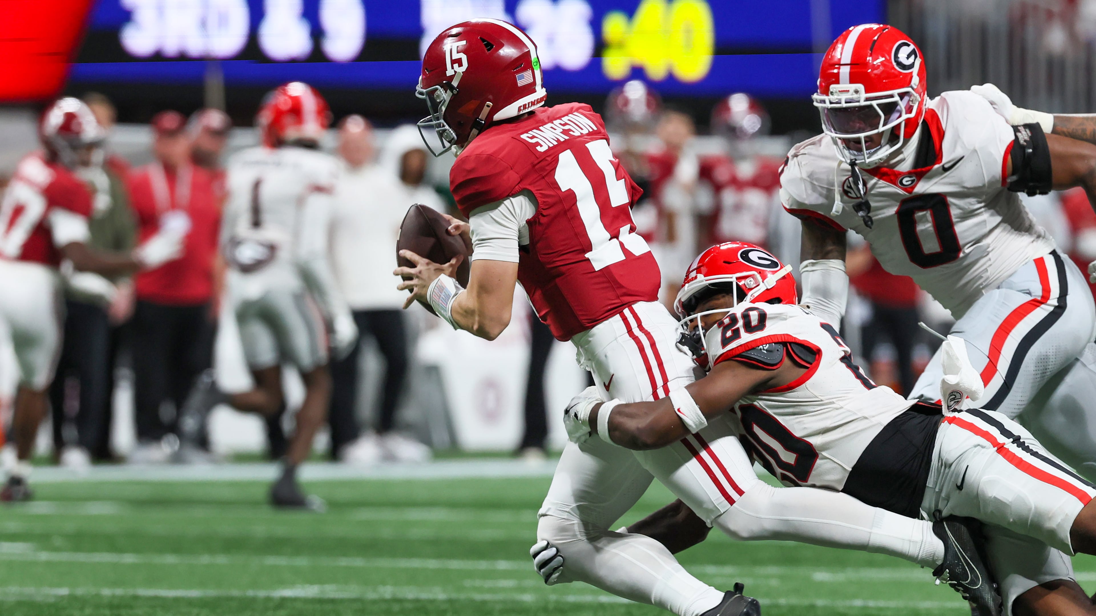 Alabama quarterback Ty Simpson was sacked three times in the SEC title game as the Georgia defense held Alabama to a season-low 209 yards. (Jason Getz/AJC)