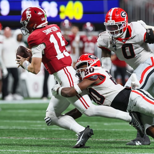 Alabama quarterback Ty Simpson was sacked three times in the SEC title game as the Georgia defense held Alabama to a season-low 209 yards. (Jason Getz/AJC)