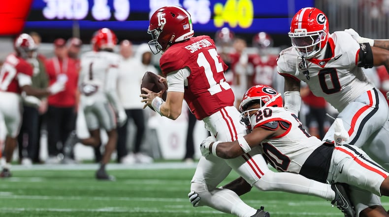 Alabama quarterback Ty Simpson was sacked three times in the SEC title game as the Georgia defense held Alabama to a season-low 209 yards. (Jason Getz/AJC)