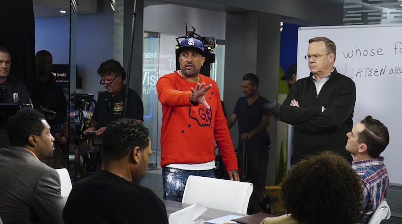 “Black-ish” creator, writer and producer Kenya Barris talks with cast members of the show.
