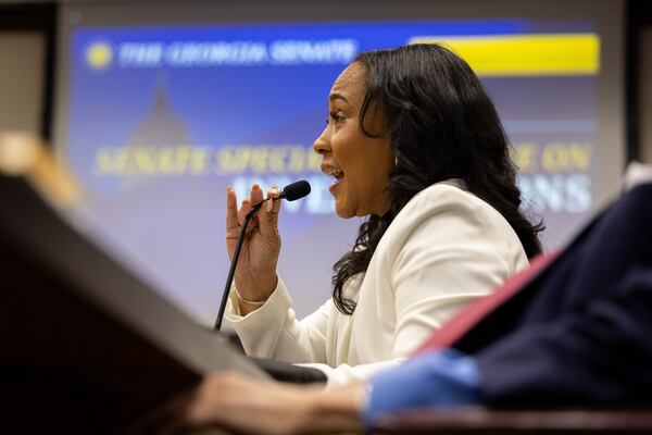 Fulton County District Attorney Fani Willis testifies before a Senate committee at the Capitol in Atlanta on Wednesday, December 17, 2025. Willis is testifying before the Senate Special Committee on Investigations — a panel created to investigate her actions in the criminal case she brought against Donald Trump and 18 others who sought to overturn the 2020 presidential election in Georgia. (Arvin Temkar/AJC)