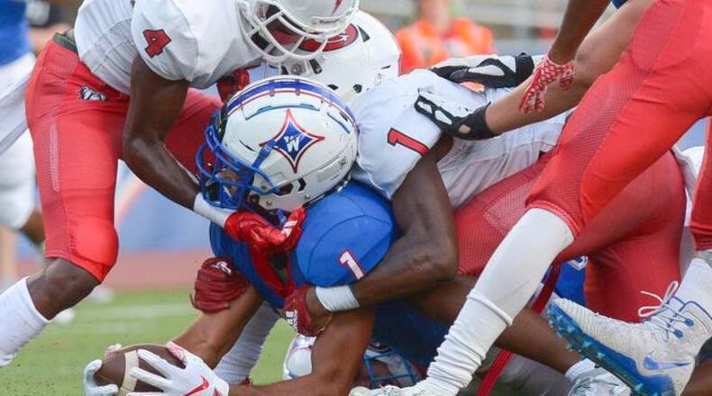 Friday Night football: Walton's Dominic Blaylock (1) is stopped on the one yard line by the North Gwinnett defense in the first half of last year’s game at Walton. Daniel Varnado/photo