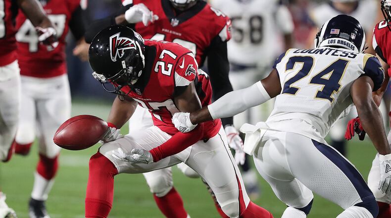 January 6, 2018 Los Angeles: The Rams Blake Countess miss handles the kick off while Falcons safety Damontae Kazee battles for the ball with the Falcons coming up with the turnover during the first quarter in their NFL Wild Card Game on Saturday, January 6, 2018, in Los Angeles. Curtis Compton/ccompton@ajc.com