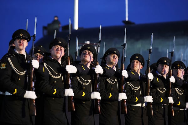 Servicemen take part in a ceremonial ship launching for the nuclear-powered submarine Perm at the Atomflot, a service base for nuclear-powered fleet, in Murmansk, Russia, Thursday, March 27, 2025. (Sergei Karpukhin, Sputnik, Kremlin Pool Photo via AP)