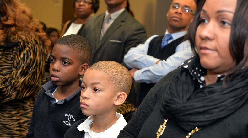 Joseph Richburg (left) and his cousin, Austin Mance at a Black History Month program honoring the Tuskegee Airmen on Thursday, February 19, 2015. KENT D. JOHNSON/KDJOHNSON@AJC.COM