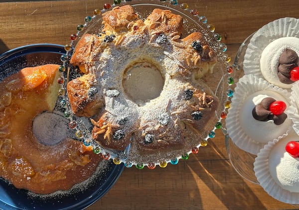 Cultures around the world celebrate the new year with festive foods thought to bring good luck. Left to right: Vasilopita, Rosca de Reyes and ganache-filled pavlova.