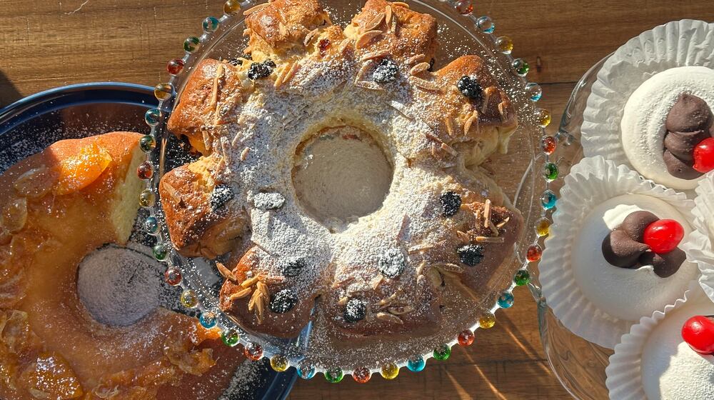 Cultures around the world celebrate the new year with festive foods thought to bring good luck. Left to right: Vasilopita, Rosca de Reyes and ganache-filled pavlova. (Meridith Ford for the AJC)