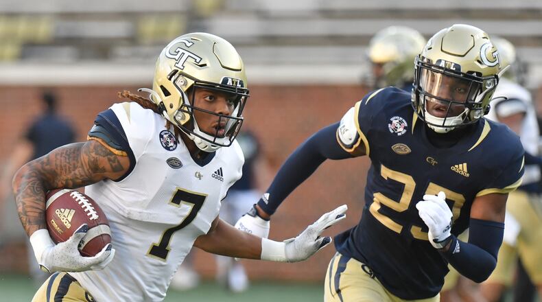 Georgia Tech receiver Malachi Carter tries to elude Yellow Jackets defensive back Khari Gee during the 2022 spring game. (Hyosub Shin / Hyosub.Shin@ajc.com)