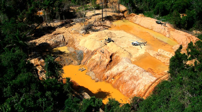 FILE - An illegal mining camp is visible from a Brazil Environmental Agency helicopter during an operation to try to contain illegal mining in Yanomami Indigenous territory, Roraima state, Brazil, Feb. 11, 2023. (AP Photo/Edmar Barros, File)