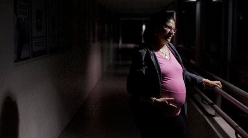 Priscila Cintron Rosa attends a talk about the dangers of the Zika virus for pregnant women at a hospital in San Juan, Puerto Rico, on Feb. 24, 2016. Women who had symptoms of Zika or tested positive should wait at least eight weeks before trying to get pregnant, officials with the Centers for Disease Control and Prevention said on March 25. (Victor J. Blue/The New York Times)