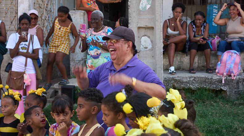 Choreographer Juan Miguel Mas leads an outdoor performance by his young dancers in a neighborhood of Havana, Cuba, Saturday, May 9, 2026. (AP Photo/Ramon Espinosa)