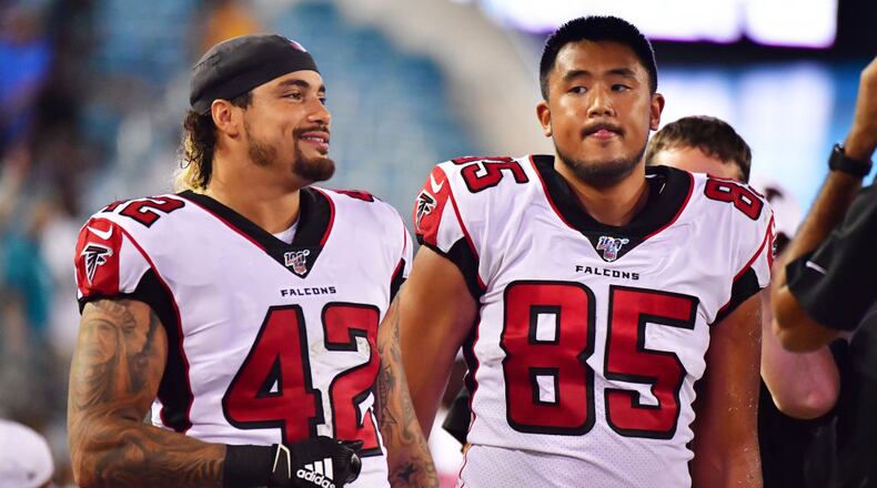 JACKSONVILLE, FLORIDA - AUGUST 29: Duke Riley #42 and Thomas Duarte #85 of the Atlanta Falcons look on during the second half of a preseason football game against the Jacksonville Jaguars at TIAA Bank Field on August 29, 2019 in Jacksonville, Florida. (Photo by Julio Aguilar/Getty Images)